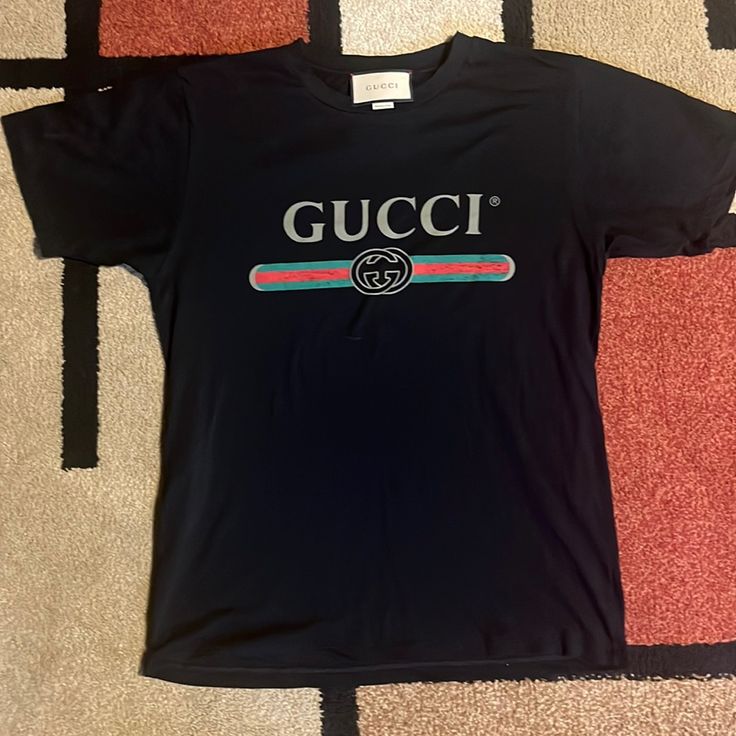 Black Cotton Jersey Xs Tshirts Gucci Woman, Gucci Luxury Sweatshirt With Logo Print, Luxury Trendy Shirt With Letter Print, Gucci Luxury Sweatshirt With Embroidered Logo, Gucci Mickey Shirt, Gucci Button-up Shirt For Spring, Gucci Designer Black T-shirt, Designer Gucci Black T-shirt, Gucci Black T-shirt With Logo Print