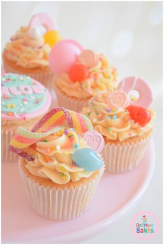 cupcakes decorated with colorful icing and decorations