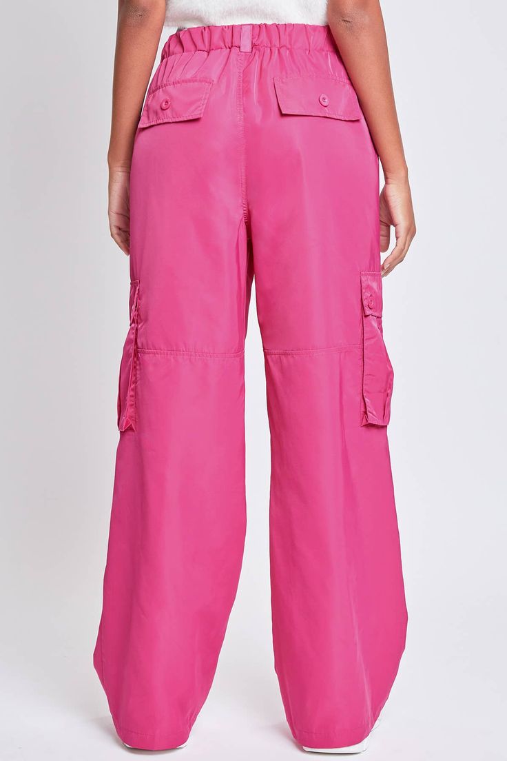 Every day is a new chance to wear our Relaxed Fit Cargo Pants. This high-waisted nylon pant features a relaxed fit for both style and comfort, ensuring you'll look good and feel good throughout the day. Includes classic front pockets, three cargo pockets with button closures, and faux back pockets. Pink Utility Wide Leg Parachute Pants, Pink Wide Leg Utility Parachute Pants, Pink Relaxed Fit Parachute Pants With Side Pockets, Pink Wide Leg Utility Pants, Pink Wide Leg Parachute Pants With Side Pockets, Pink Wide-leg Parachute Pants With Cargo Pockets, Spring Nylon Pants With Cargo Pockets, Relaxed Fit Wide Leg Nylon Parachute Pants, Wide-leg Nylon Parachute Pants With Pockets