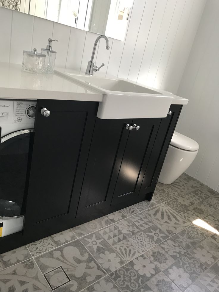 a washer and dryer in a small bathroom