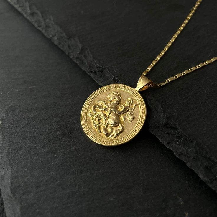 St. George Necklace - Elevate your style with our exquisite coin pendant, a tribute to the legendary patron saint of courage and chivalry. This timeless piece features a meticulously crafted coin pendant, showcasing the iconic image of St. George slaying the dragon. Suspended from a delicate yet sturdy chain, this necklace seamlessly blends history and fashion. Made with precision and passion, it's more than jewelry - it's a statement of strength, bravery, and enduring style. Embrace the symbolism and wear this St. George coin necklace as a daily reminder of your own resilience and valor. A meaningful gift or a personal indulgence, this necklace transcends trends, making it a cherished addition to any jewelry collection. Diameter 25 mm The legend recounts that upon Saint George's arrival a George Necklace, Fierce Dragon, Roman Army, Closet Clothing, Mosque Art, Saint George's, Coin Pendant Necklace, Saint George, Chalkboard Art