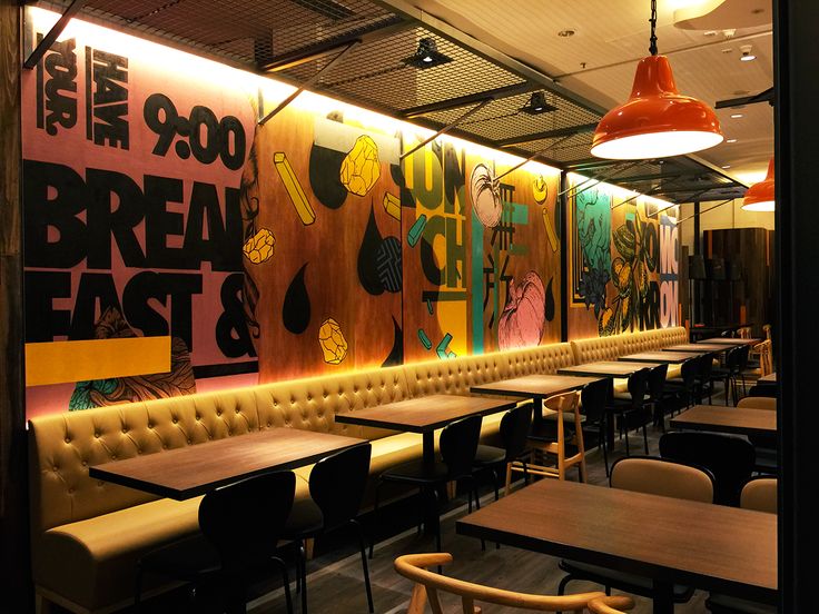 an empty restaurant with tables and chairs