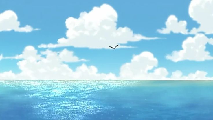 a bird flying over the ocean under a blue sky with white clouds and some water