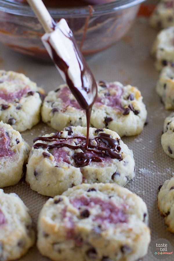 chocolate chip cookies are being drizzled with icing