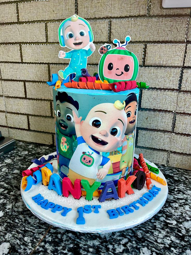 a birthday cake with cartoon characters on it