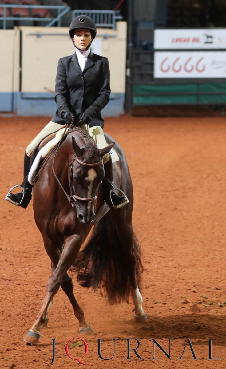 a woman riding on the back of a brown horse