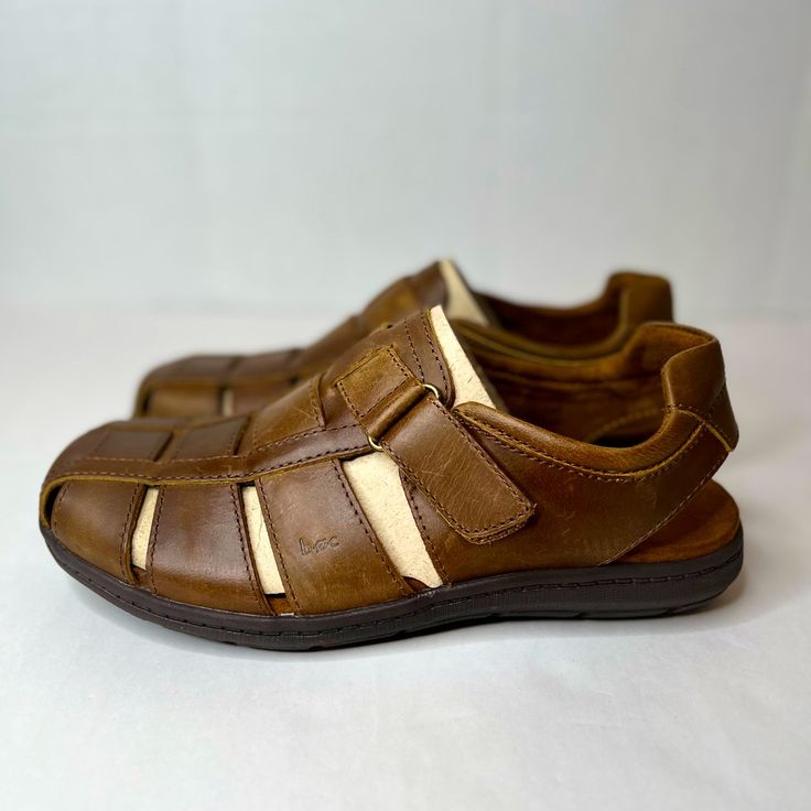 Men's B.O.C, Sebastens Sandal. This Handsome Fisherman Sandal Offers A Comfortable Option For Warm Weather Wear. A Versatile Style That Can Be Worn With Everything From Khakis To Shorts. Features Distressed Leather Uppers In A Fisherman Style Design Slip On Styling With Adjustable Hook And Loop Strap For Easy On And Off Smooth Linings Padded Comfort Footbed With Padded Heel Strap Manmade Outsole Tech Specs Style: Backstrap, Casual, Comfort, Heeled Sandals Heel Height: 1.00 Material: Leather Toe Brown Closed Toe Walking Sandals, Brown Closed Toe Sandals For Walking, Casual Brown Sandals With Ortholite Insole, Brown Slip-on Walking Sandals, Brown Slip-on Sandals For Walking, Rugged Brown Sandals With Cushioned Footbed, Brown Rugged Sandals With Cushioned Footbed, Casual Brown Walking Sandals, Rugged Brown Slip-on Sandals