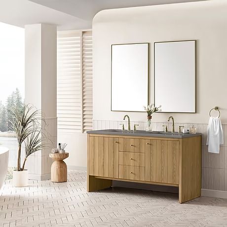 a bathroom with two sinks, mirrors and a bathtub in the middle of it