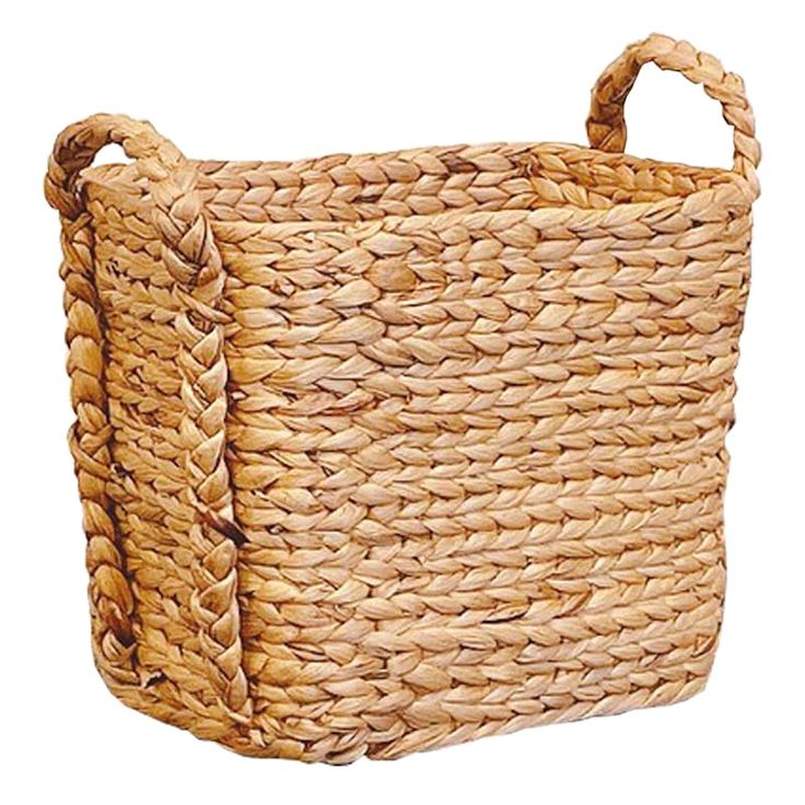 a woven basket with handles on the front and side, in natural colors is isolated against a white background