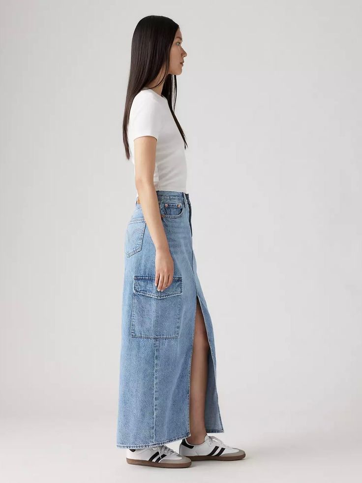 Few styles are as versatile and easy as a midi skirt. Casually cool and a little '90s, our Ankle Column Cargo Skirt features a flattering mid rise, an ankle-skimming midi length, utility pockets and a playful slit right down the middle. A versatile cargo midi skirt With a flattering mid rise Finished with utility pockets Denim Non-stretch Button fly Non 5 Pocket Wash your jeans once every 10 wears at most; this increases their lifespan and saves natural resources. FIT TIP: Easy Through The Hip M Cargo Midi Skirt, Levis Outfit, Column Skirt, Long Denim Skirt, Utility Pockets, Knit Bottom, Lifestyle Trends, Cargo Skirt, Printed Mini Dress