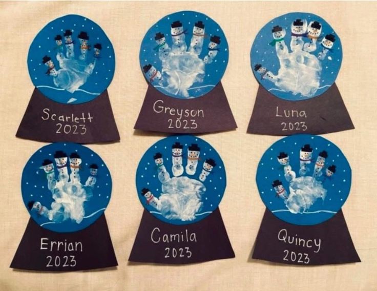 four snowman handprints with names and pictures on them are shown in the shape of magnets