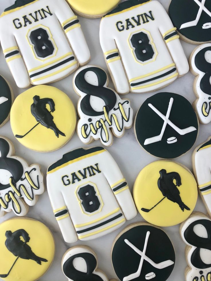 hockey themed cookies are arranged on a table