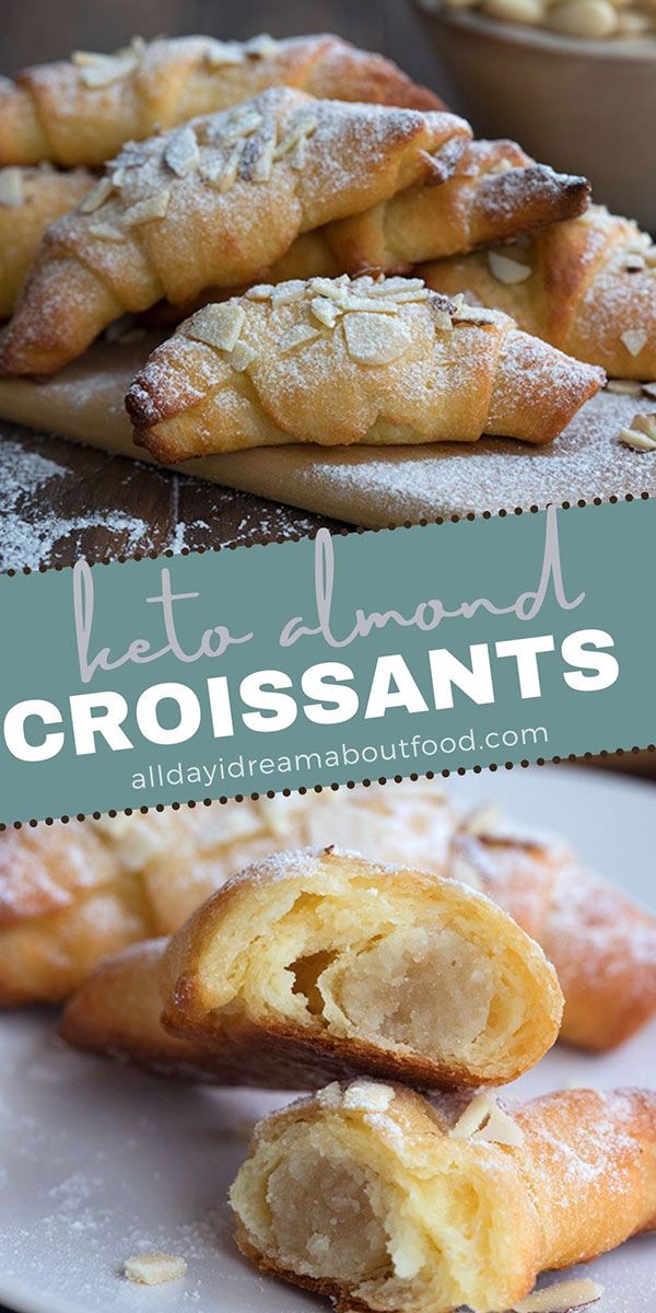 some croissants are on a plate with powdered sugar