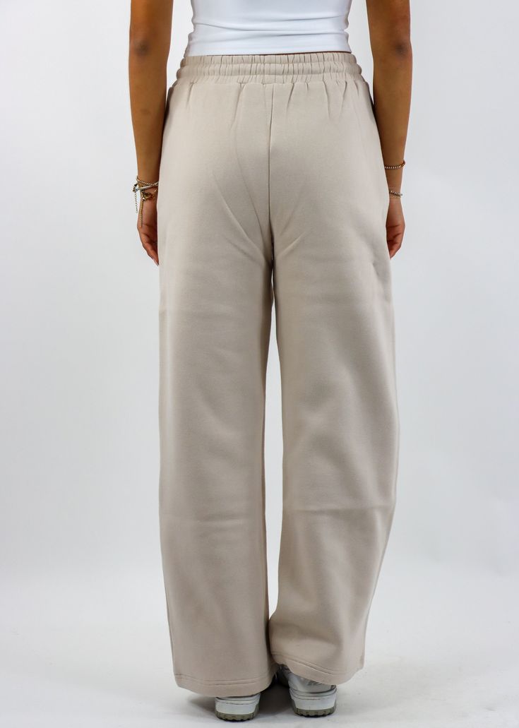 Stay cozy and stylish with these straight leg sweatpants! Featuring a relaxed straight-leg design with convenient pockets and a drawstring waist, these sweatpants are perfect for lounging or running errands. The soft fabric ensures all-day comfort, while the versatile beige hue makes them easy to style with your favorite casual tops. The Details Pockets Drawstring Waist Straight Leg 50% Cotton, 50% Polyester [#other] Machine Wash Cold with Like Colors Tumble Dry Low for 5 Minutes, Then Hang to D Comfy Sweatpants With Side Pockets For Lounging, Beige Athleisure Bottoms For Everyday, Relaxed Straight Leg Sweatpants With Ribbed Waistband, Comfortable Sweatpants With Straight Hem For Lounging, Cozy Fit Comfortable Sweatpants With Pockets, Relaxed Solid Sweatpants With Straight Hem, Cozy Fit Sweatpants With Pockets For Leisure, Comfortable Cozy Fit Sweatpants With Pockets, Comfy Leisure Sweatpants With Side Pockets