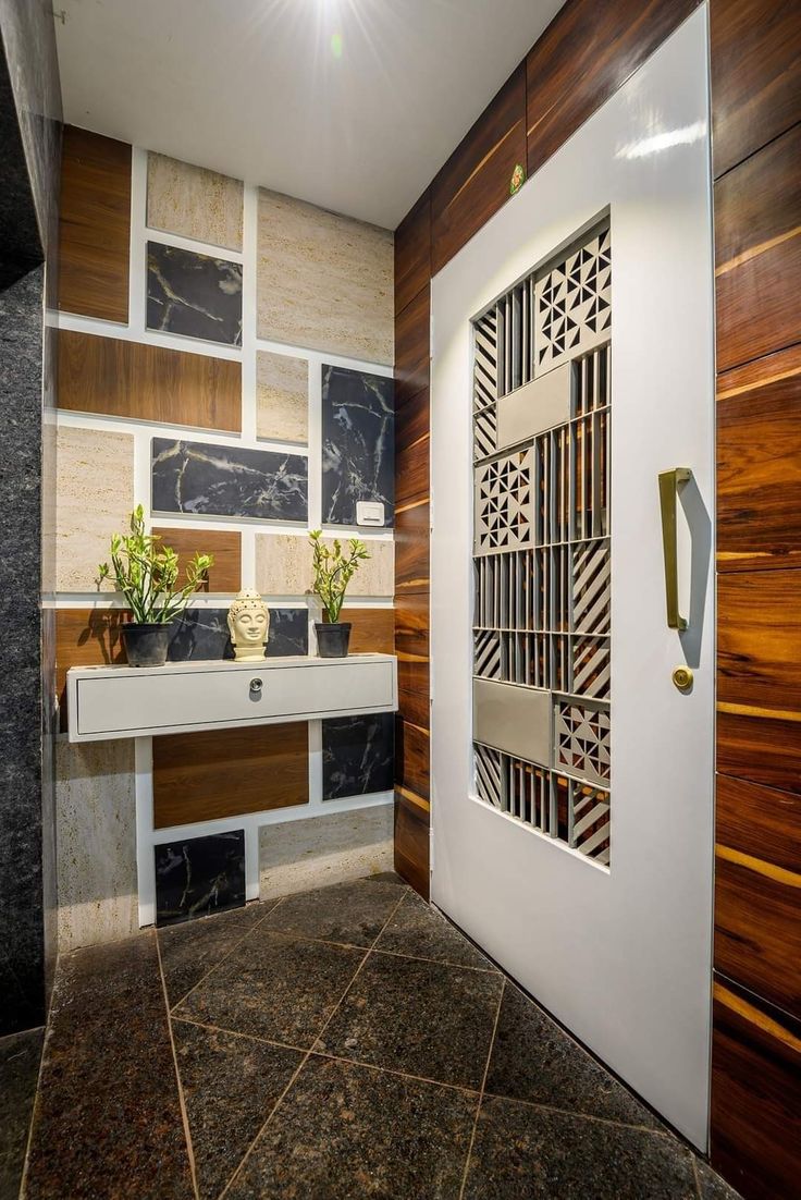 a bathroom with wood paneling and tile flooring next to a white sink in front of a mirror