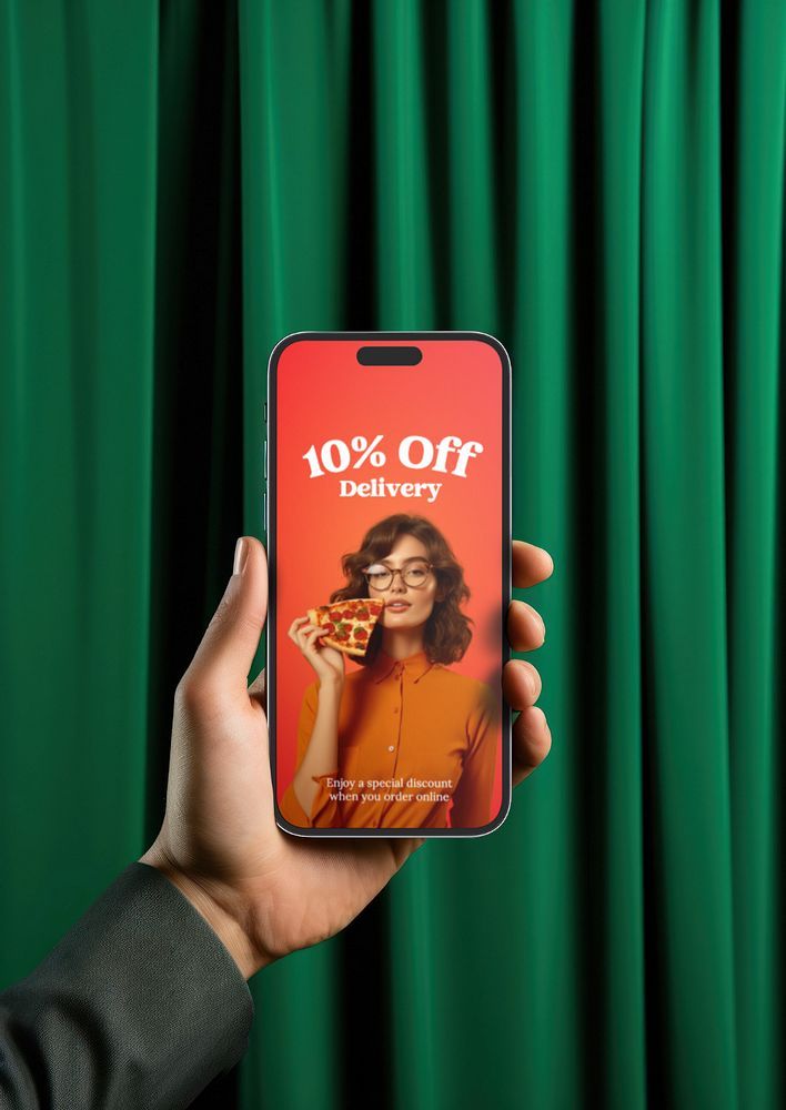 a person holding up an iphone with the 10 % off delivery on it in front of green curtains