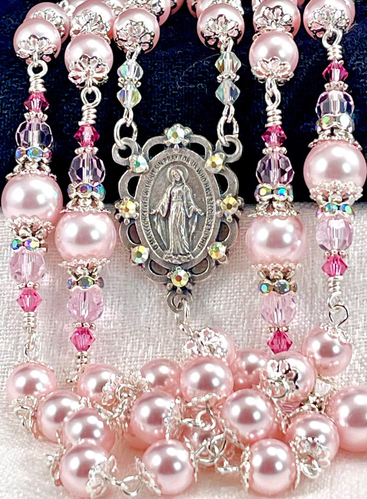 Magnificent 8mm and 10mm Pastel Pink Austrian crystal pearl rosary made with the finest quality satin smooth pearls, Preciosa crystals, and silver plated embellishments.  You can't tell the difference between these beautiful pearls and Swarovski pearls. The color, luster, and weight are as identical as it gets.  Since Swarovski has exited the market, these Austrian crystal pearls have definitely moved seamlessly into their place!  I use these interchangeably with my Swarovski Rosaline pink pearl Beautiful Rosaries, Pink Rosary, Baby Baptism Gifts, Pearl Rosary, Catholic Wedding, Communion Gifts, Rosary Catholic, Wedding Bridal Bouquets, Catholic Gifts