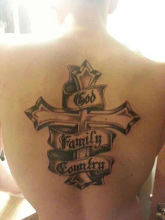 a man with a cross tattoo on his back that says family country and the word god