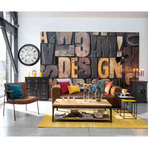 a living room filled with furniture and a large clock mounted to the wall above it