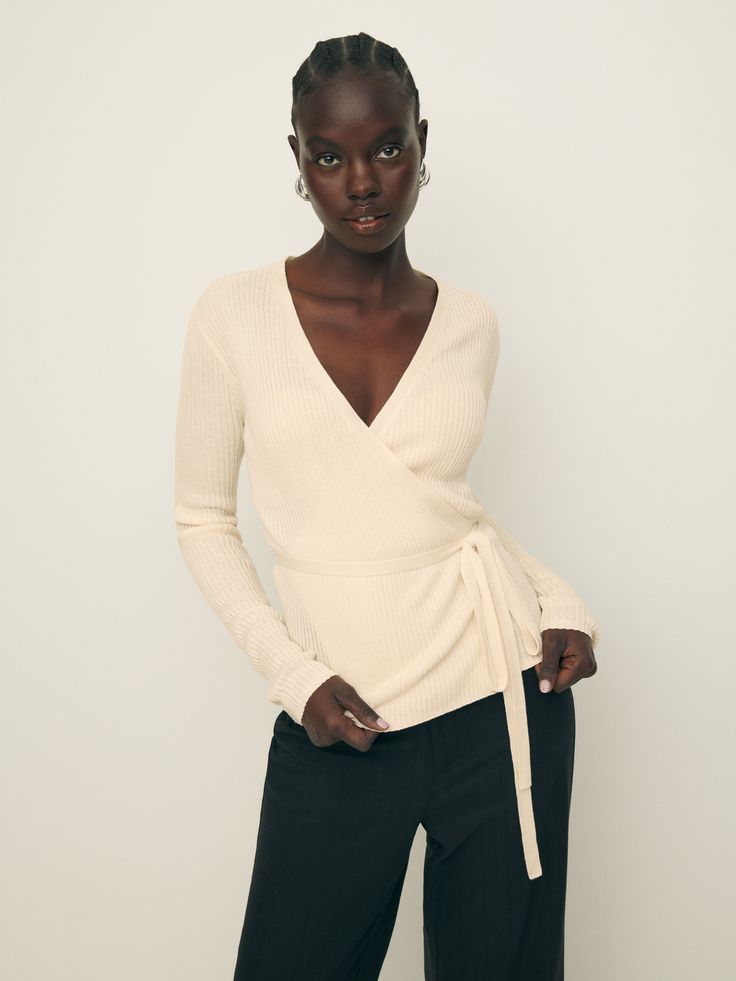 Layer up. Shop the Blaire Ribbed Wrap Cardigan from Reformation, a long-sleeve wrap cardigan with an adjustable tie. Fall Layering Wrap Top, Elegant Wrap Top For Spring Layering, Elegant Spring Wrap Top For Layering, Fitted Wrap Top For Winter, Chic Wrap Top For Winter, Wrap Sweater For Winter Workwear, Wrap Sweater For Work In Winter, Winter Wrap Sweater For Workwear, Winter Wrap Sweater For Work