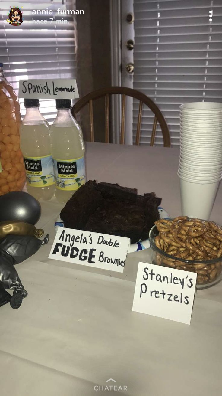 a table topped with lots of different types of food and drinks on top of it