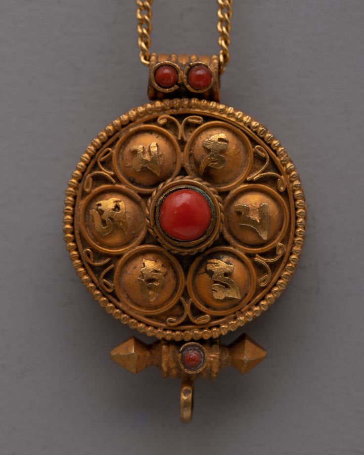 an old gold locke with red stones in it