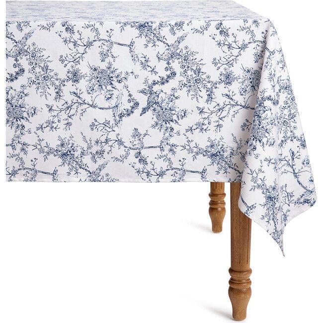 a blue and white floral tablecloth on a wooden leg with an old - fashioned design