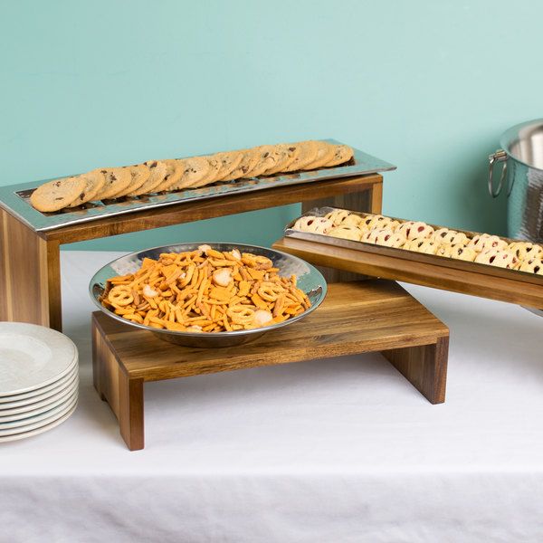 cookies and crackers are sitting on the table next to each other, along with bowls of food