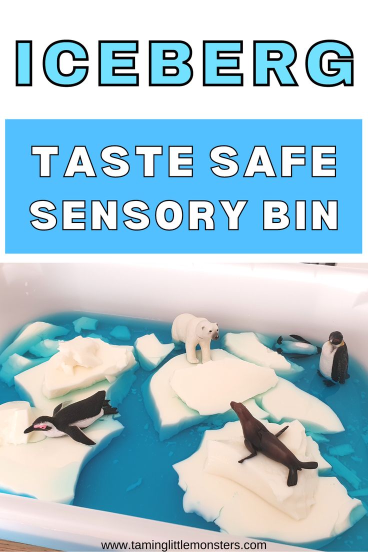 an icebergg tray filled with fake sea animals and text that reads taste safe sensory bin