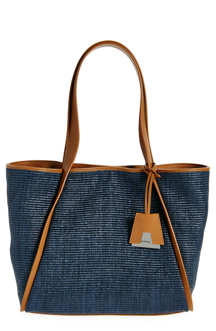 Unsnap the side gussets on this raffia bag when you need a spacious shopper and snap them together again to create the signature Akris trapezoidal silhouette. Leather trim stylishly reinforces its convertibility. Magnetic-snap closure Shoulder straps Removable interior zip and clamp pocket Protective metal feet Unlined Raffia/leather Imported Designer Handbags Bucket Tote, Together Again, Raffia Bag, Leather Bucket, Leather Trim, Leather Trims, Snap Closure, Shoulder Straps, Designer Handbags