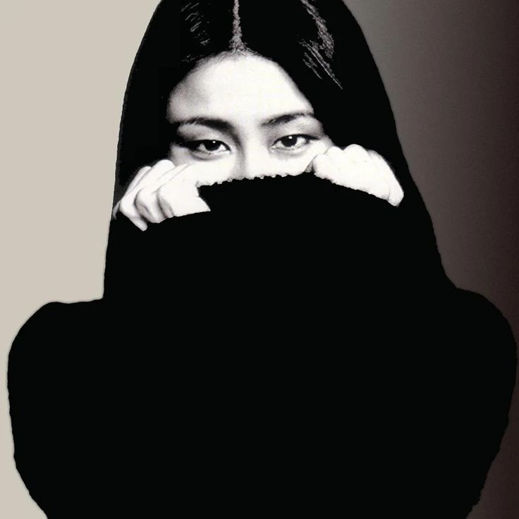 a woman with long black hair covering her face