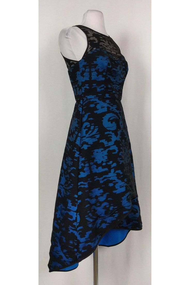 This dress from Milly is a unique treasure you will cherish for years to come. Featuring a mesh neckline that cascades into a bold blue sweetheart neckline and ends with a dramatic flared, high-low skirt. Trust us, no one will have this one on at your next event. Pair with drop earrings and a bold clutch to prep for a night full of confidence and compliments! Size 2 Made in the USA Boning in bodice Sweetheart neckline Black mesh straps Defined waist High-low structured flared skirt Key-hole back Blue A-line Dress With Lined Bodice, Blue Prom Dress With Lined Bodice, Blue Fitted Dress With Lined Bodice, Blue Dress With Lined Bodice For Prom Season, Fitted Blue A-line Evening Dress, Blue Fitted A-line Evening Dress, Blue Cocktail Dress With Lined Bodice, Blue Dress With Flattering Silhouette For Evening, Formal Blue Evening Dress With Lined Bodice