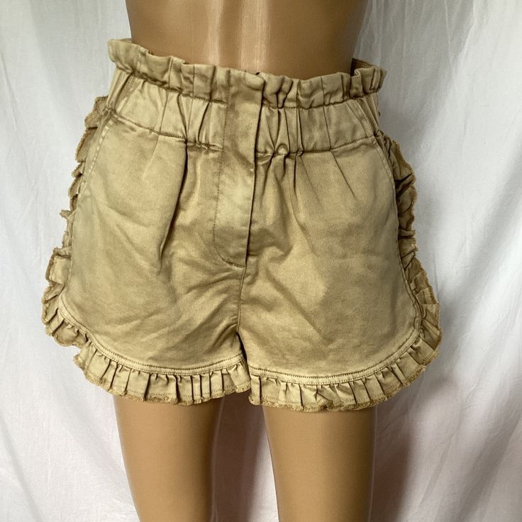 Nwt. Paper Bag Style Waist. Frills On Sides & Hem. Thick Cotton Polyester Elastane Blend With A Distressed Suede Look. Size Small. Length From Waist 15”.Inseam 3”. Waist Laying Flat 13.5”. Beige Bottoms For Summer Outings, Beige Bottoms For Summer, Chic Beige Shorts For Summer Outings, Beige Shorts For Spring Day Out, Khaki Shorts For Summer Day Out, Trendy Khaki Shorts For Summer, Summer Beige Ruffled Bottoms, Brown Cotton Shorts For Spring, Beige Ruffled Shorts For Summer