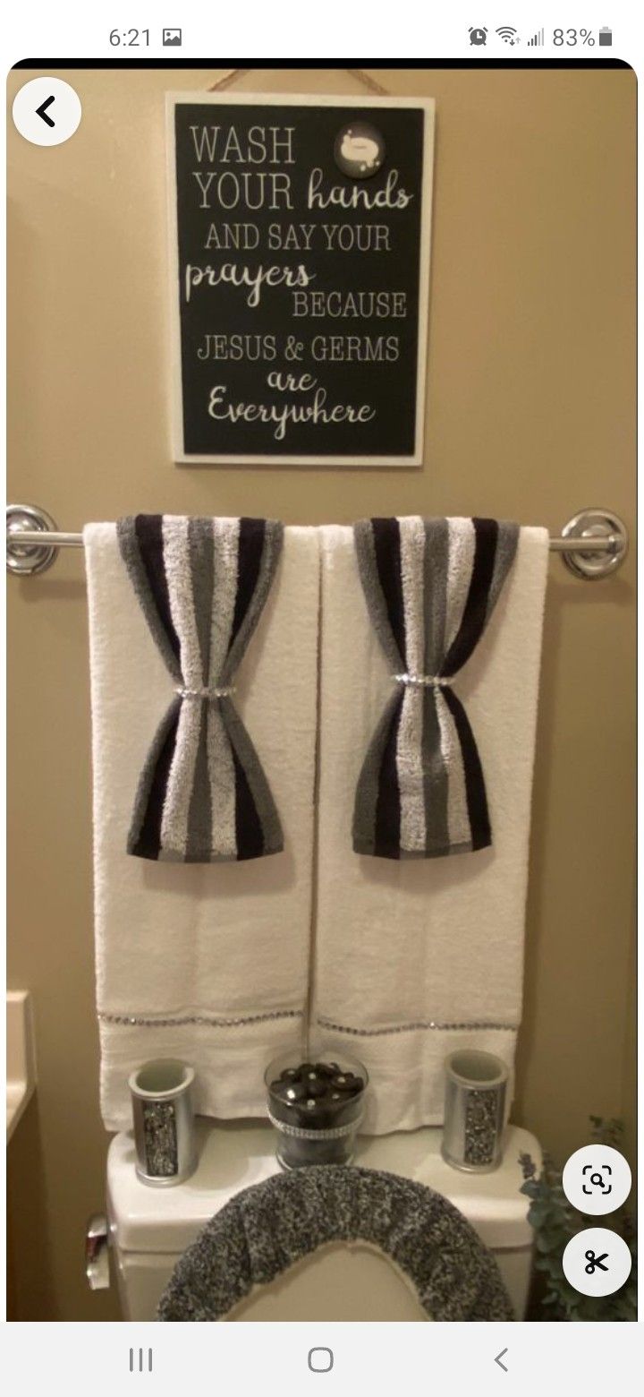 a bathroom with two towels hanging on the wall