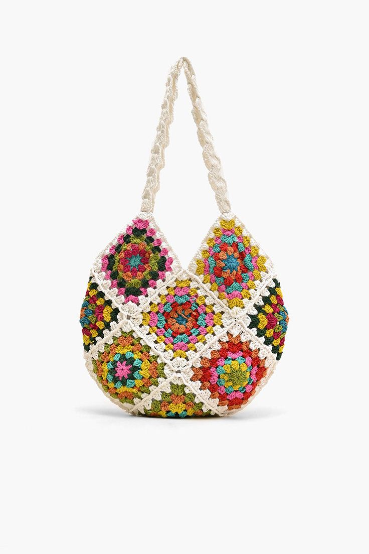 a multicolored handbag hanging on a white string with an intricate design in the middle