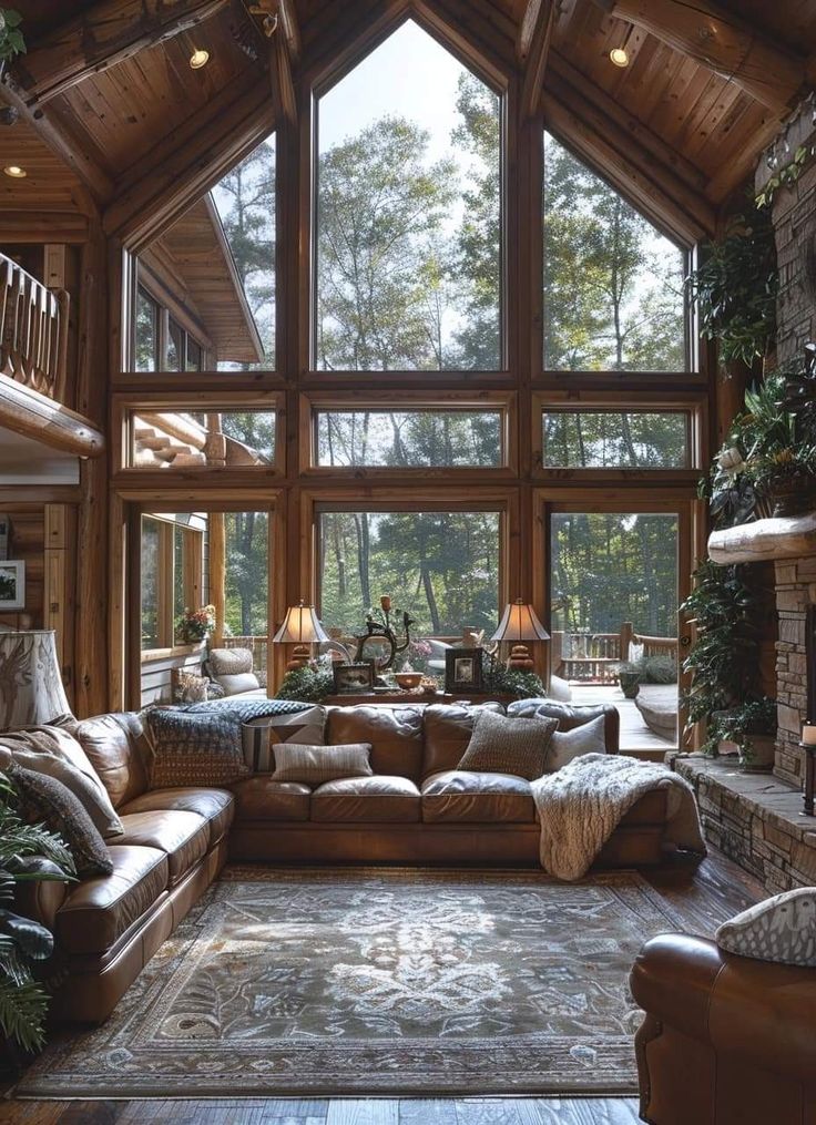 a living room filled with lots of furniture next to a large window covered in wood