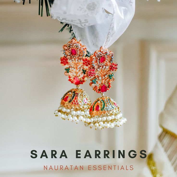 Emanate luxury and royalty in our Sara Earrings that can elevate any ensemble! A vibrant hued nauratan pair of earrings dispersed with brilliant stone work and is balanced with pearl moti clusters. Approximate earrings length is 3.5". Gold-plated on high-quality brass as base metal. Made by order. Kindly allow 4-6 weeks for the delivery of this item. For custom or urgent requests, please contact support@alacouture.com. *Please Note: The multi-colored beadwork might be slightly varying in pattern Jeweled Pearl Earrings For Festivals, Jeweled Earrings For Festivals, Jeweled Pearl Earrings For Festive Occasions, Festive Jeweled Earrings, Festive Fusion Pearl Earrings For Festivals, Unique Gift Cards, Diwali Sale, Heritage Jewellery, Create Words