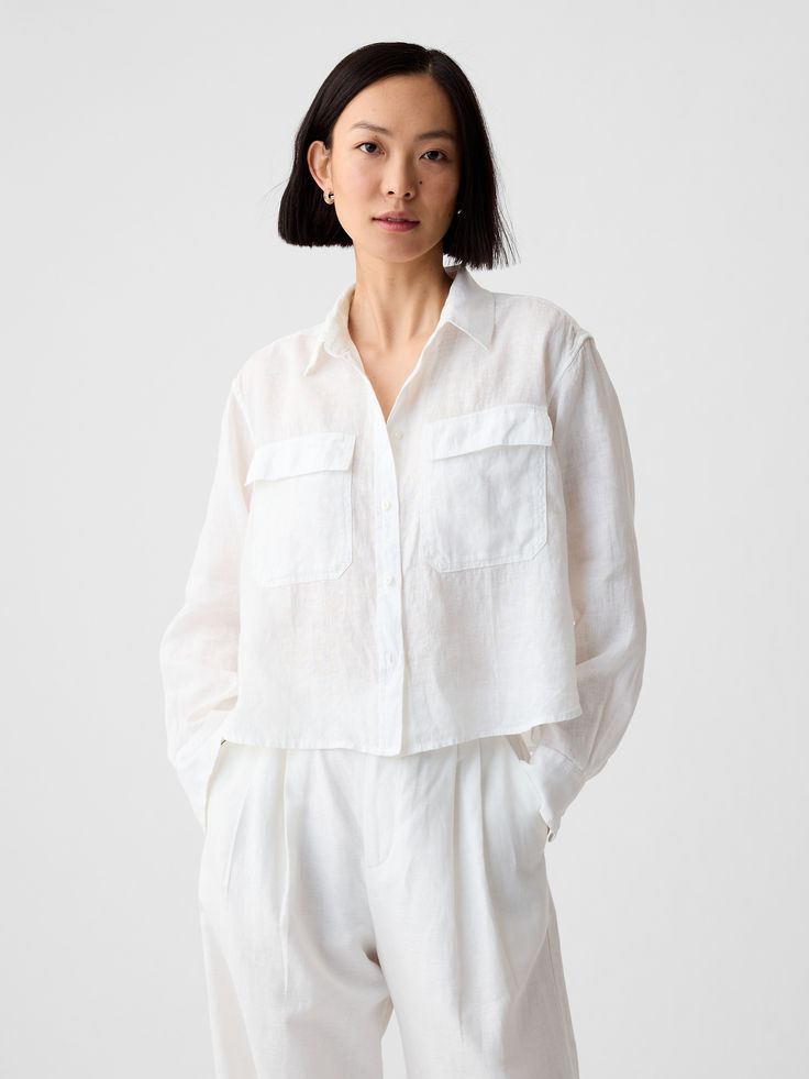 Soft, breathable linen cropped shirt.  Point collar.  Long sleeves with button cuffs.  Button front.  * Fit: Slightly fitted.  Sits close to the body.  Cropped, hits at the waist.  Note: Tyla is wearing a Gap Pants For Short Women, Long Sleeve Layering, Linen Crop Top, Linen Crops, Layered Shirts, Linen Bottoms, Cropped Shirt, Elbow Sleeve, Shirt And Pants