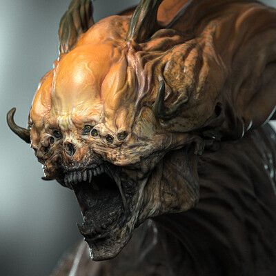 a close up of a statue of a demon with its mouth open and fangs out