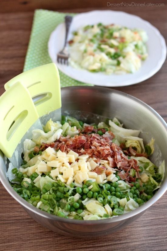 two bowls filled with food on top of a wooden table