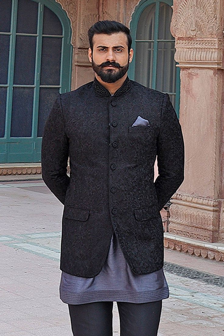 Black bundi with floral embroidered motifs and front button placket. Paired with kurta and pant.
Components: 3
Fabric: Raw Silk
Neckline: Mandarin
Sleeve Length: Full
Color: Black
Embroidered
Flap pockets
Patch pockets
Note: Pocket square worn by the model is not for sale - Aza Fashions Elegant Nehru Jacket With Chikankari Embroidery, Black Long Sleeve Nehru Jacket For Diwali, Designer Bandhgala With Stand Collar For Festivals, Black Long Sleeve Bandhgala With Chikankari Embroidery, Black Embroidered Nehru Jacket For Diwali, Embroidered Black Nehru Jacket For Diwali, Traditional Nehru Jacket With Long Sleeve For Semi-formal Occasions, Traditional Black Outerwear With Chikankari Embroidery, Bandhgala With Chikankari Embroidery For Eid