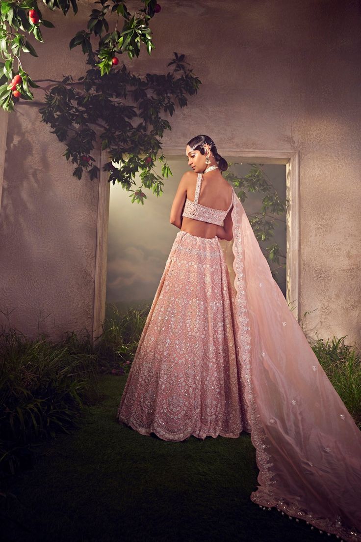 Featuring an orchid pink organza lehenga with white thread work. It is embellished with sequence and bugle beads.From Aneesh Agarwaal's Ellora collection.DELIVERY TIMEPlease allow 8-12 weeks for your outfit to arrive.FABRIC DETAILSOrganzaProfessional cleaning only. Pink Organza Lehenga With Cutdana, Pink Organza Choli With Cutdana, Pink Tissue Silk Choli With Mirror Work, Pink Cutdana Organza Choli, Pink Organza Anarkali Set With Cutdana, Pink Cutdana Anarkali Set In Organza, Pink Embellished Organza Lehenga, Pink Tissue Silk Lehenga With Sheer Dupatta, Embellished Pink Organza Anarkali Set