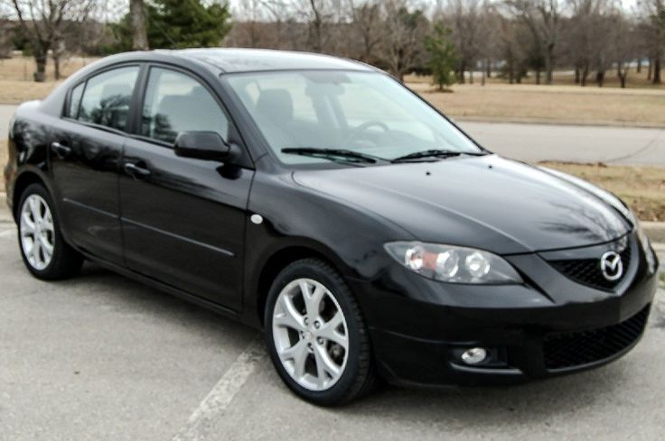 a black car parked in a parking lot