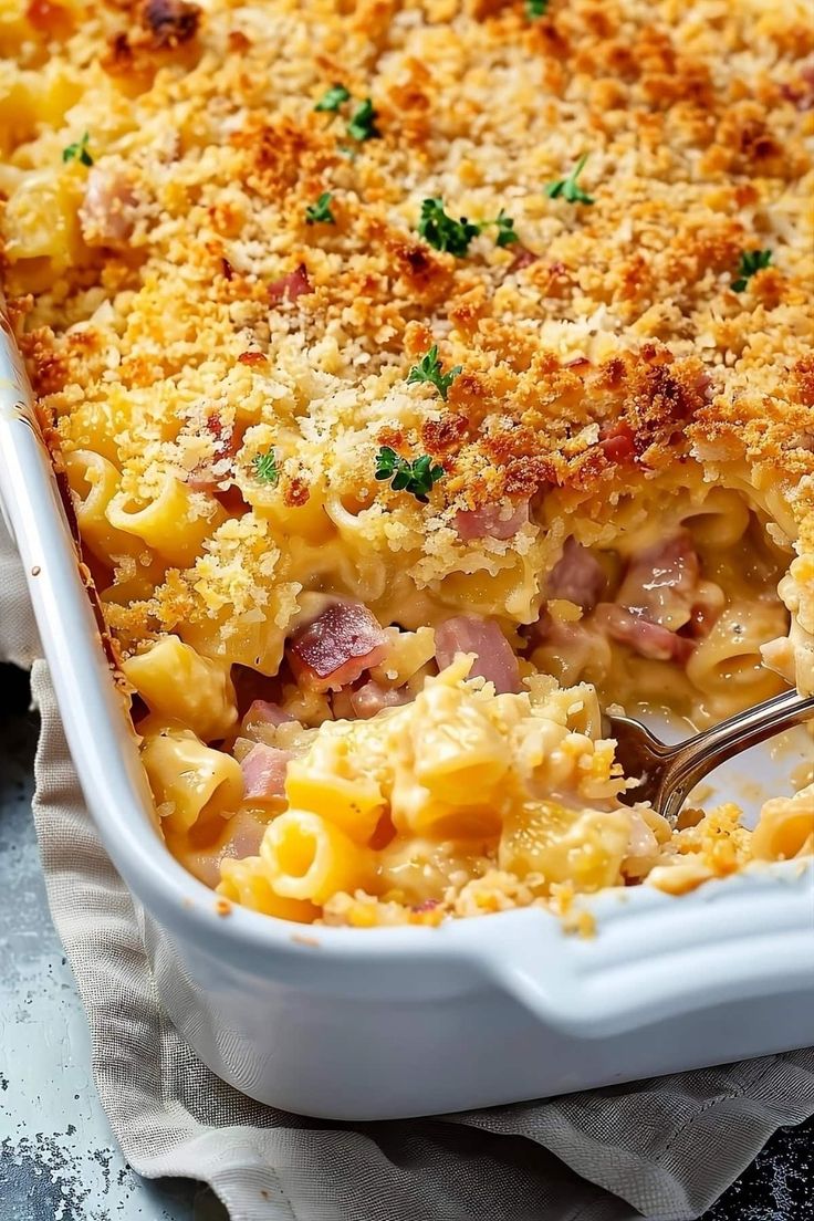 a casserole dish with ham and cheese