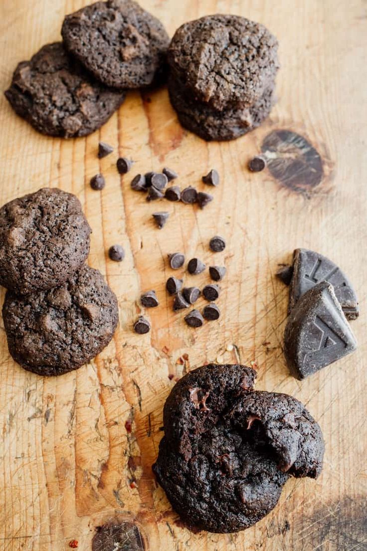 cookies and chocolate chips on a wooden cutting board