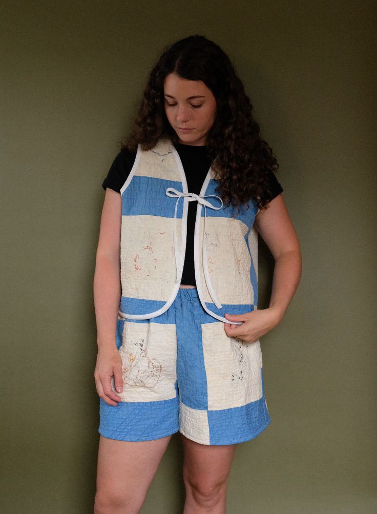 This quilt vest was made using a vintage quilt sourced from Minnesota, handcrafted the early 1900s. It features a stunning blue color palette and cross stitch & embroidered details than have worn over time. The pattern created for this vest has been designed to fit a variety of bodies. The sizing is boxy and accommodating to many body types! This quilt is light to medium weight, perfect for a transition in most seasons!Always remember that this coat is made from an antique quilt that has seen de Quilt Vest, Spring Runway, Quilt Coat, Blue Color Palette, Antique Quilt, Blue Cross, Vintage Quilt, Blue Colour Palette, Blue Embroidery