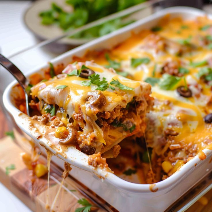 a casserole dish with meat, cheese and vegetables