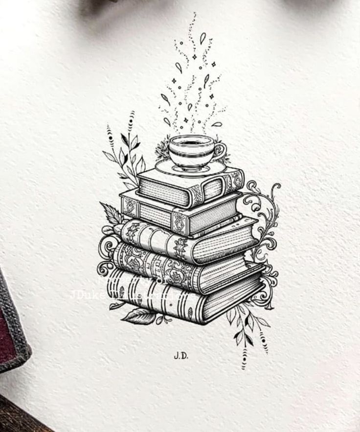 a stack of books sitting on top of a table next to a pen and ink