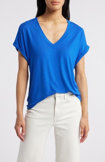 A roomy fit and cuffed sleeves amp up the low-key vibe of this V-neck T-shirt made from a soft and drapey Tencel® modal-blend. 25" length (size Medium)   V-neck   Short sleeves   67% Tencel® modal, 28% polyester, 5% spandex   Tencel modal is a sustainably produced fiber made with closed-loop processing and is certified with the EU Ecolabel as having a low environmental impact throughout the entire lifecycle   Dry clean or machine wash, tumble dry   Imported   Women's Clothing Relaxed Blue V-neck Top, Blue Top With Rolled Sleeves For Everyday, Blue Tops With Rolled Sleeves For Everyday, Everyday Blue Tops With Rolled Sleeves, Relaxed Blue Tops With Shirttail Hem, Blue Tops With Rolled Sleeves And Shirttail Hem, Casual Blue Top With Rolled Sleeves, Casual Blue Tops With Rolled Sleeves, Environmental Impact