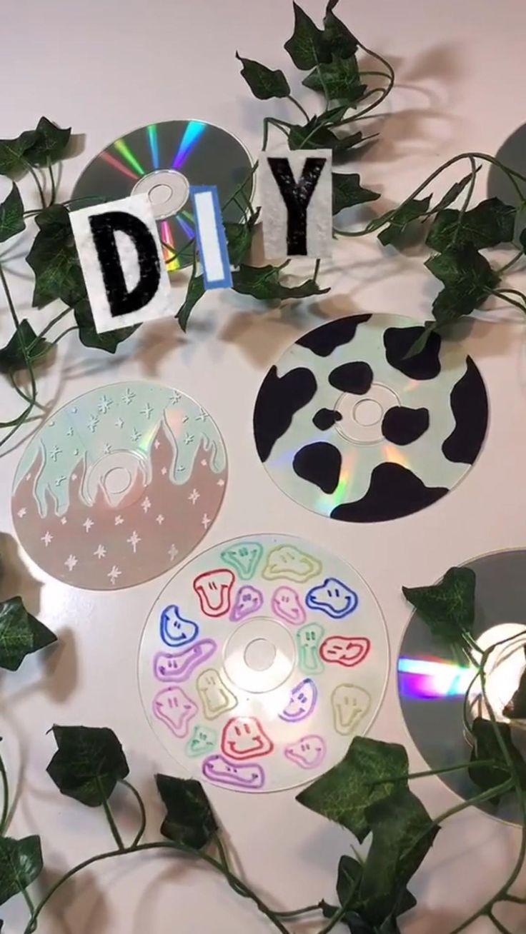 various cd discs and plants with the word diy spelled out in front of them